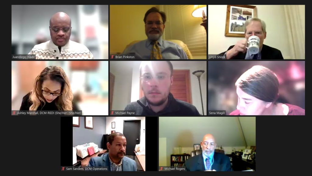 8 people are shown in grid, a screenshot of a virtual meeting.